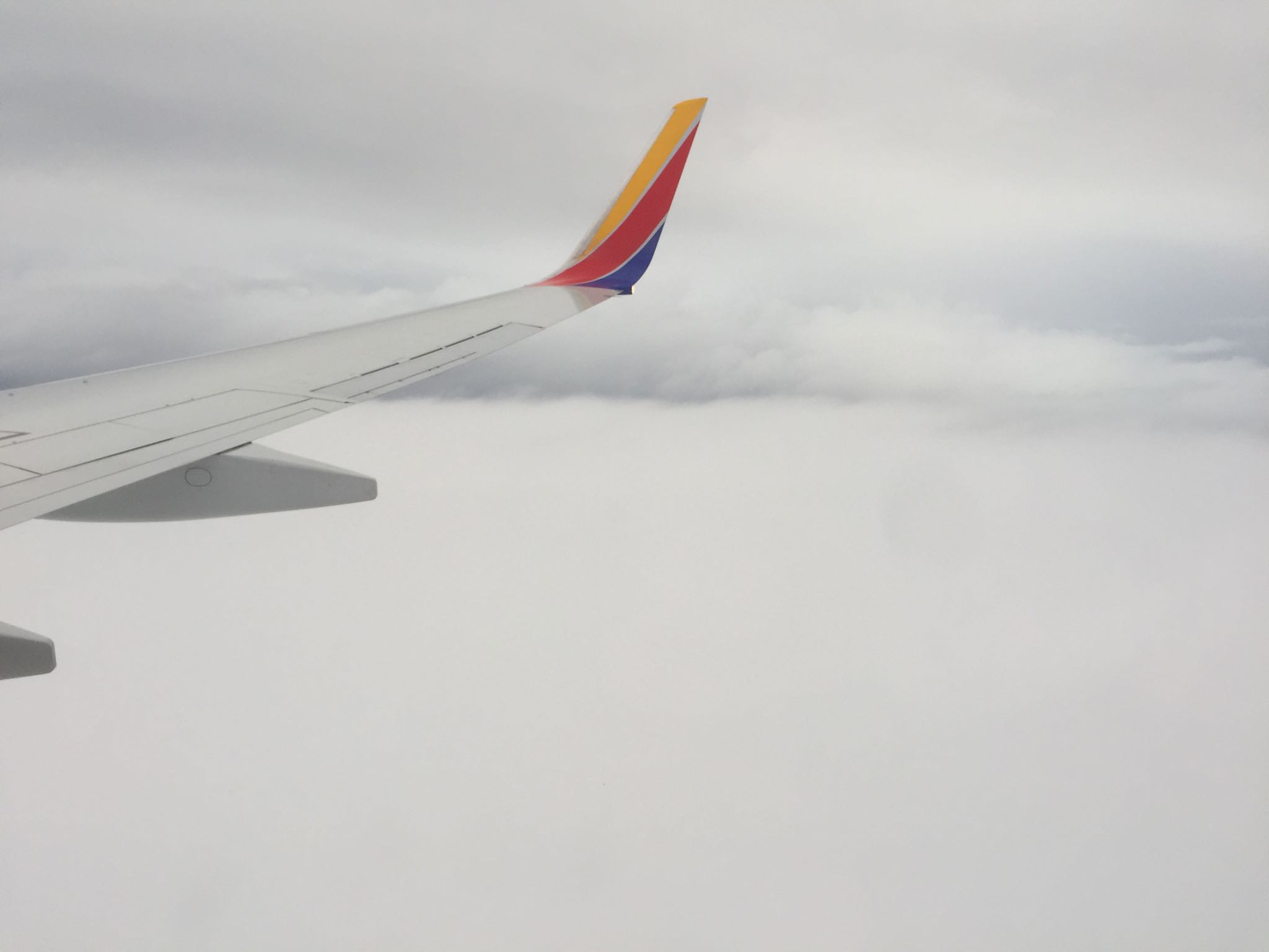 Flying back to LGA after CES with the wing tip in the clouds